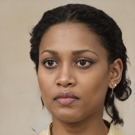 Neutral black young-adult female with long  black hair and brown eyes