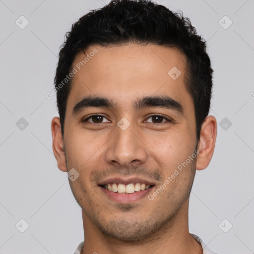 Joyful white young-adult male with short  black hair and brown eyes