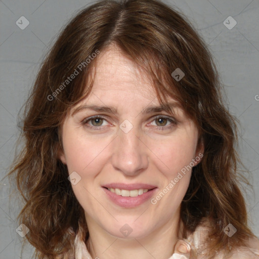 Joyful white adult female with medium  brown hair and blue eyes