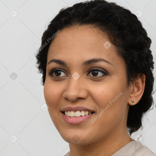 Joyful latino young-adult female with short  brown hair and brown eyes