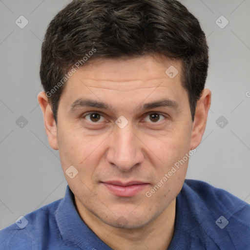 Joyful white adult male with short  brown hair and brown eyes