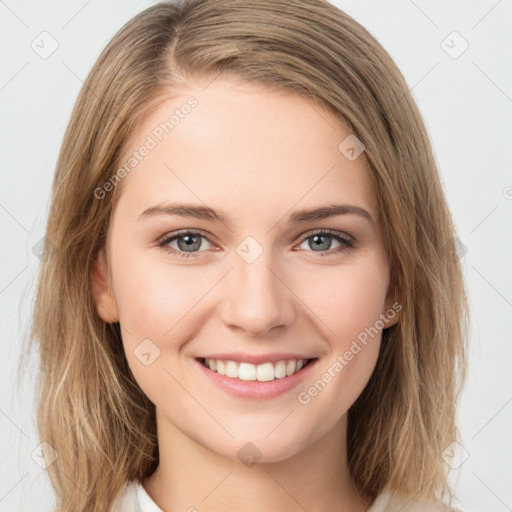 Joyful white young-adult female with medium  brown hair and green eyes