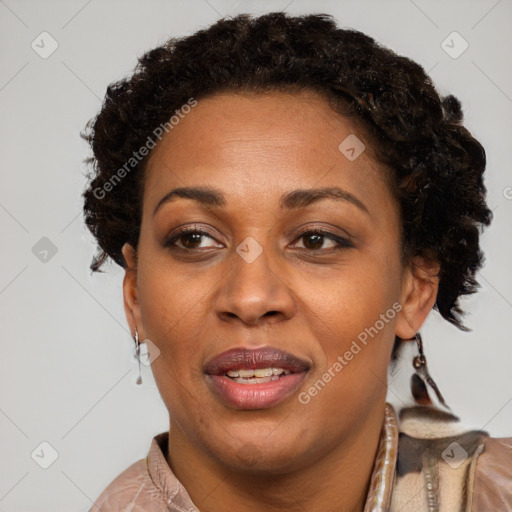 Joyful black adult female with short  brown hair and brown eyes