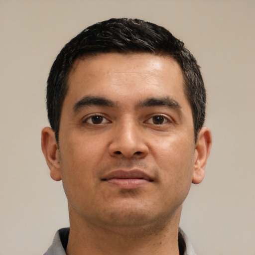 Neutral latino young-adult male with short  black hair and brown eyes