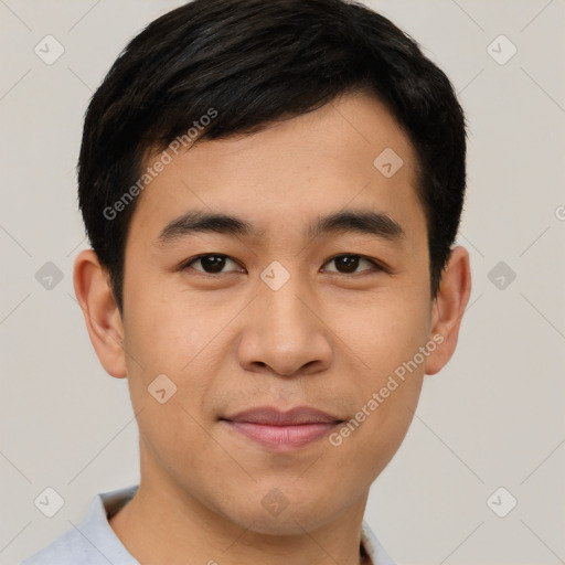 Joyful asian young-adult male with short  black hair and brown eyes