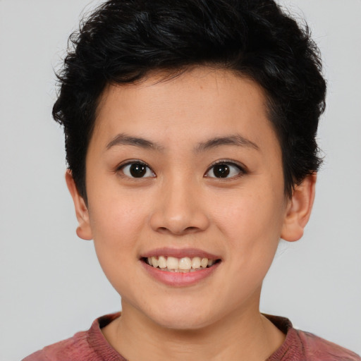 Joyful asian young-adult female with short  brown hair and brown eyes