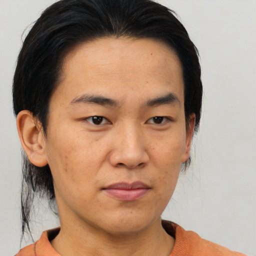 Joyful asian young-adult male with medium  black hair and brown eyes