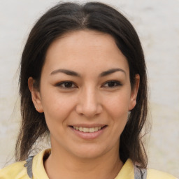 Joyful asian young-adult female with medium  brown hair and brown eyes