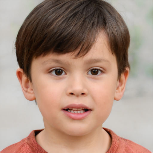 Joyful white child male with short  brown hair and brown eyes