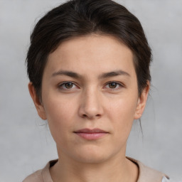 Neutral white young-adult female with short  brown hair and brown eyes