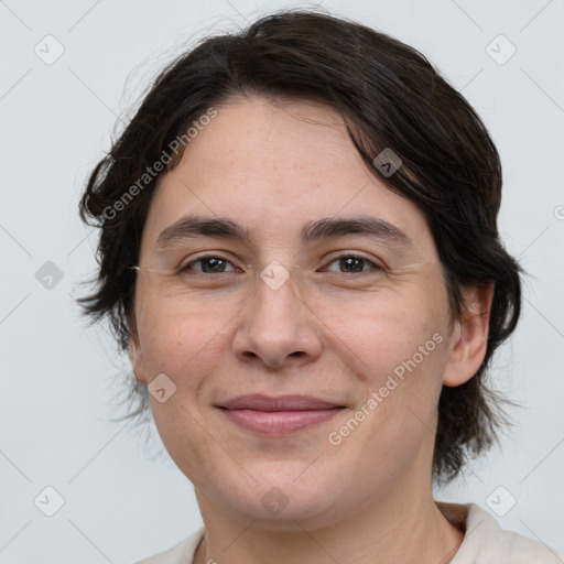 Joyful white adult female with medium  brown hair and brown eyes