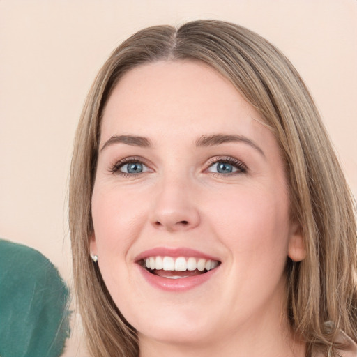 Joyful white young-adult female with long  brown hair and green eyes