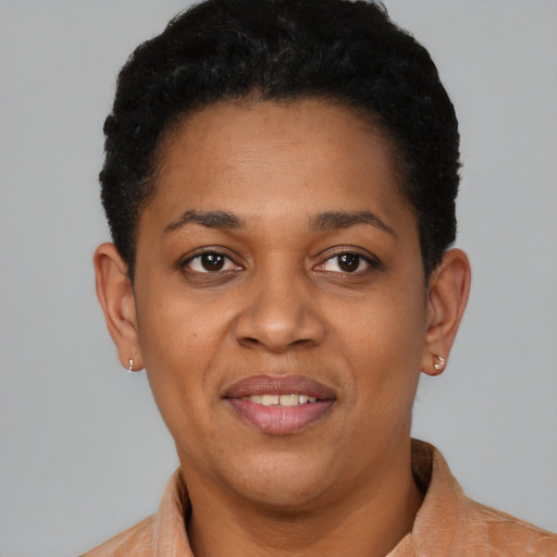 Joyful latino young-adult female with short  brown hair and brown eyes