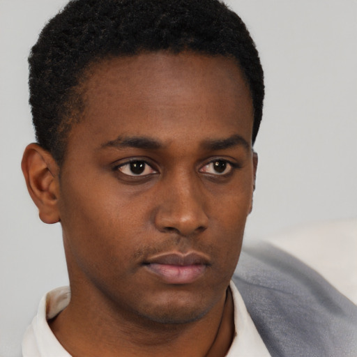 Neutral black young-adult male with short  brown hair and brown eyes
