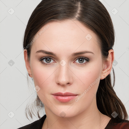 Neutral white young-adult female with long  brown hair and brown eyes