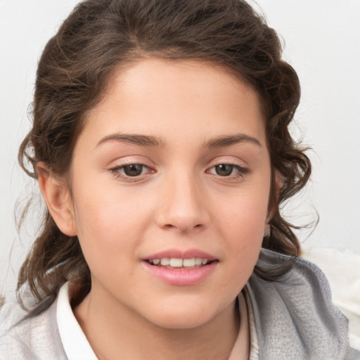 Joyful white child female with medium  brown hair and brown eyes