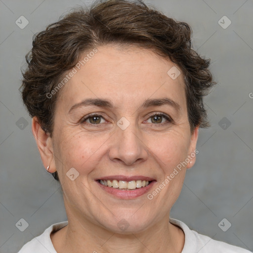 Joyful white adult female with short  brown hair and brown eyes