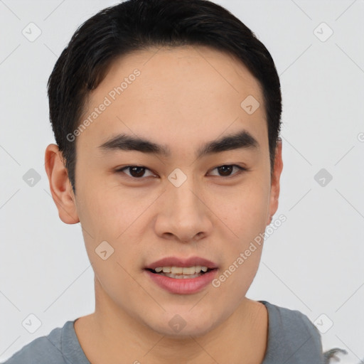 Joyful asian young-adult male with short  black hair and brown eyes