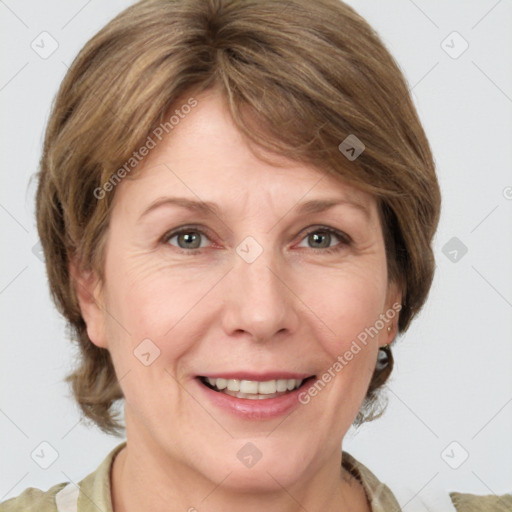 Joyful white adult female with medium  brown hair and grey eyes