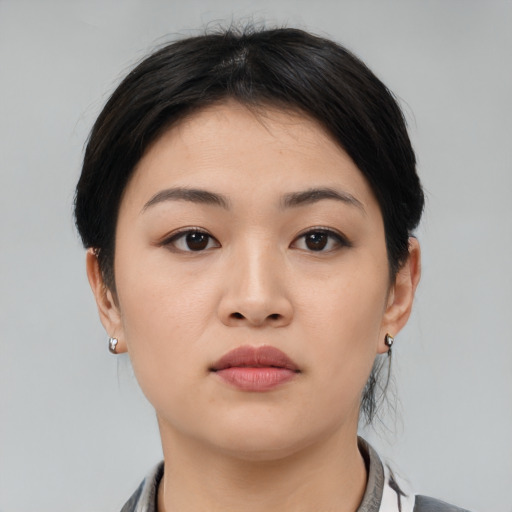 Neutral asian young-adult female with medium  black hair and brown eyes