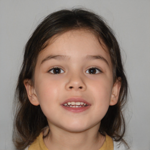 Joyful white child female with medium  brown hair and brown eyes