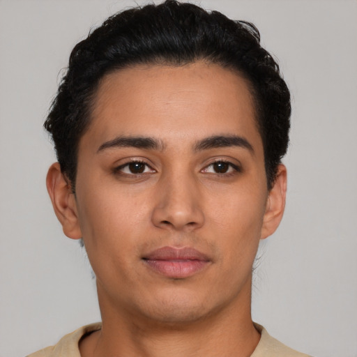 Neutral latino young-adult male with short  black hair and brown eyes