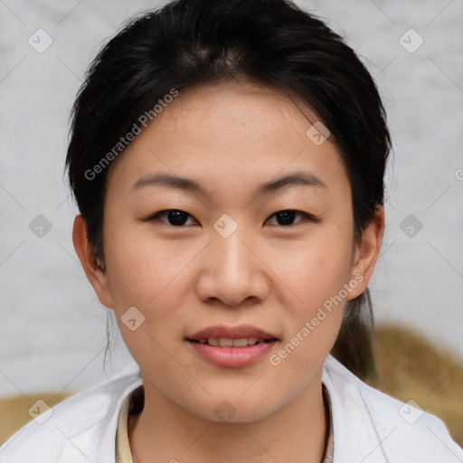 Joyful asian young-adult female with short  brown hair and brown eyes