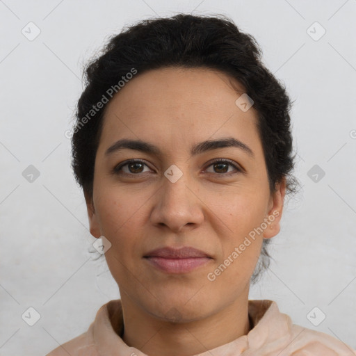 Joyful latino young-adult female with short  brown hair and brown eyes