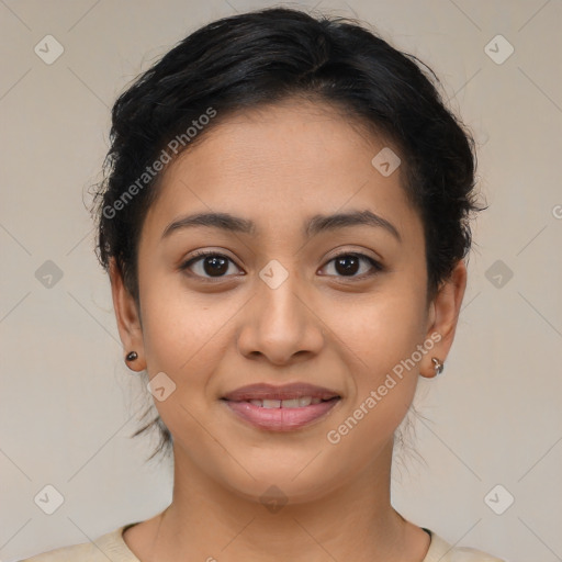 Joyful latino young-adult female with medium  brown hair and brown eyes