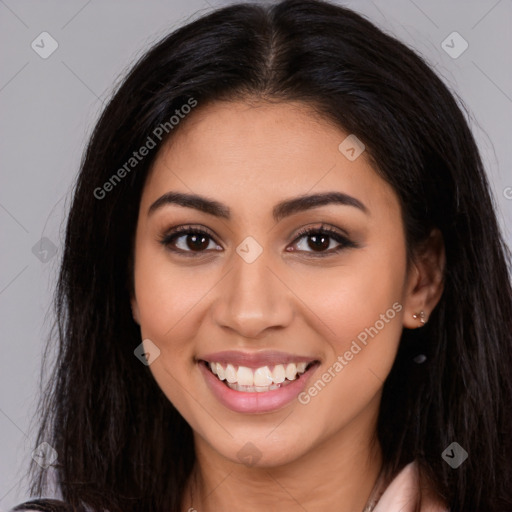 Joyful latino young-adult female with long  brown hair and brown eyes