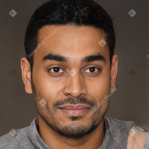 Joyful latino young-adult male with short  black hair and brown eyes