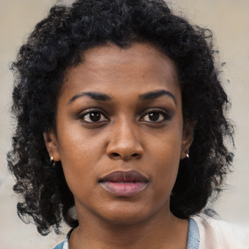 Neutral black young-adult female with medium  black hair and brown eyes