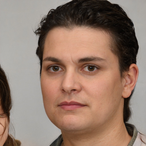 Neutral white young-adult male with medium  brown hair and brown eyes