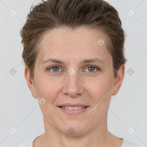 Joyful white adult female with short  brown hair and grey eyes