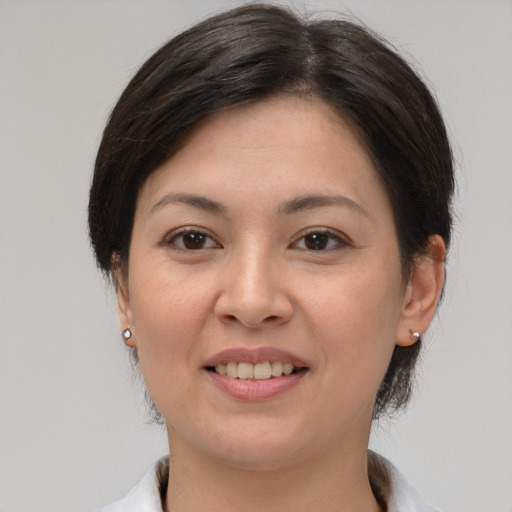 Joyful white young-adult female with medium  brown hair and brown eyes