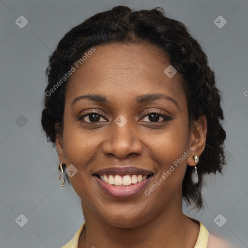 Joyful black young-adult female with medium  brown hair and brown eyes