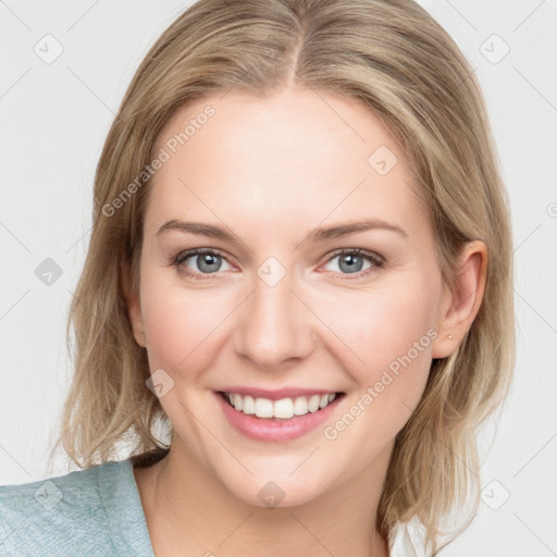 Joyful white young-adult female with medium  brown hair and blue eyes