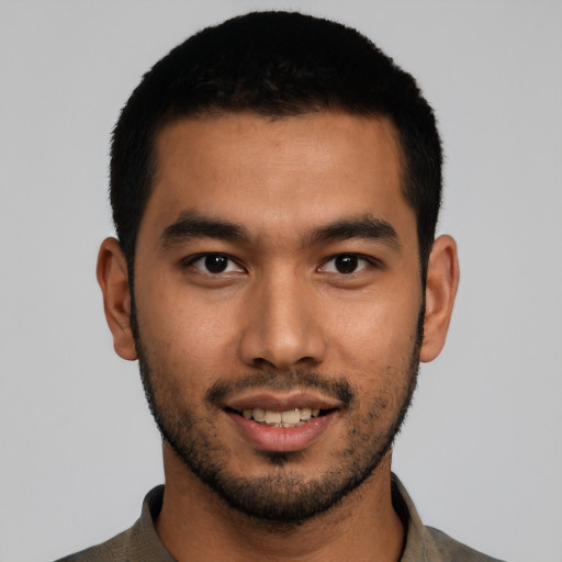 Joyful asian young-adult male with short  black hair and brown eyes