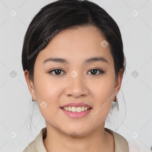 Joyful asian young-adult female with medium  black hair and brown eyes