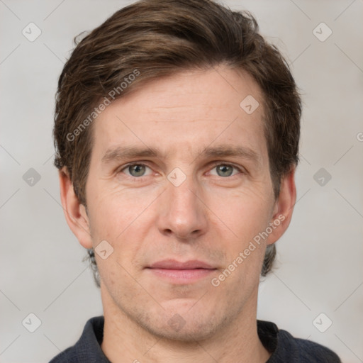 Joyful white adult male with short  brown hair and grey eyes