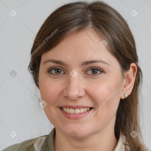 Joyful white young-adult female with medium  brown hair and grey eyes