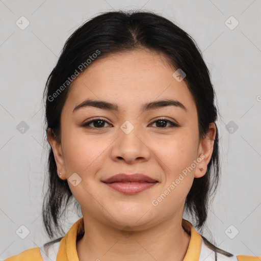 Joyful latino young-adult female with medium  brown hair and brown eyes