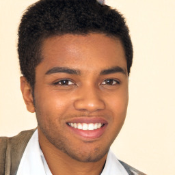 Joyful black young-adult male with short  brown hair and brown eyes