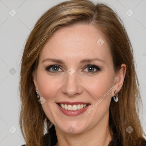 Joyful white adult female with long  brown hair and grey eyes