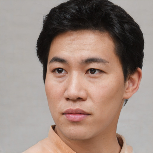 Neutral asian young-adult male with short  brown hair and brown eyes