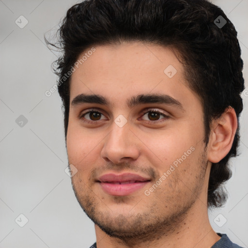 Joyful white young-adult male with short  black hair and brown eyes