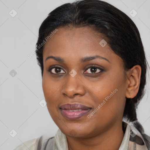 Joyful black young-adult female with medium  brown hair and brown eyes