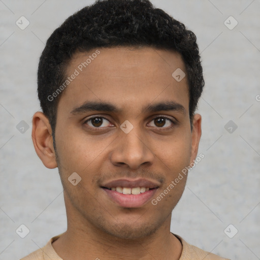 Joyful latino young-adult male with short  brown hair and brown eyes