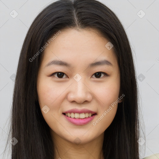 Joyful asian young-adult female with long  brown hair and brown eyes