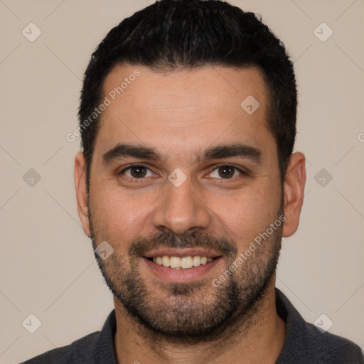 Joyful white young-adult male with short  black hair and brown eyes